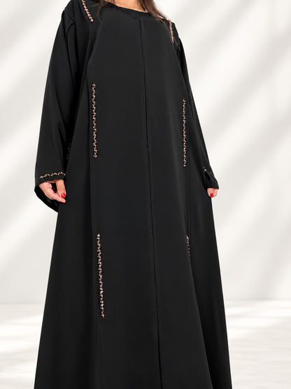 Devant de l'abaya Nimat, broderie de cristaux dorés et mauves